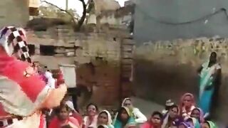The village woman is dancing showing off her tits