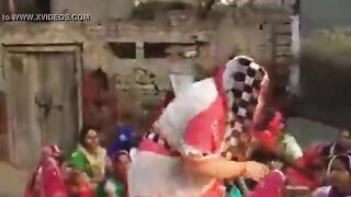 The village woman is dancing showing off her tits